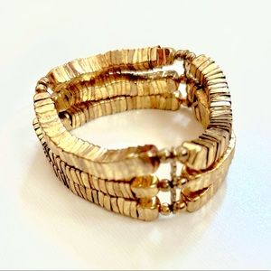 Bold statement bracelet, gold color pleated, flexible